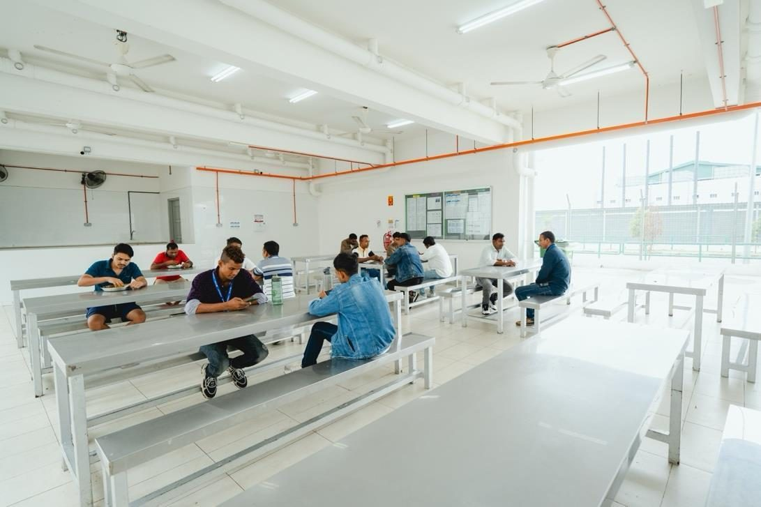 Workers dining in the hostel canteen